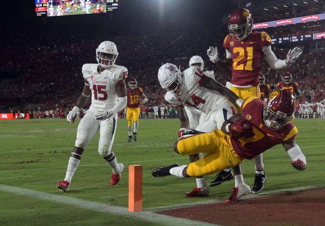 USC running back Stephen Carr dives into the end zone Saturday night for one of his two touchdowns.