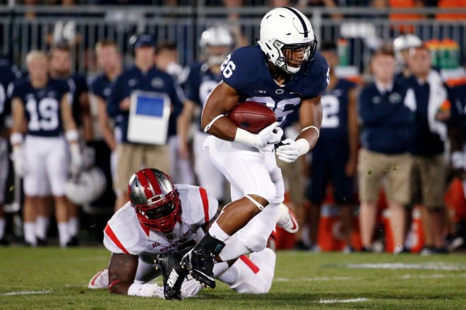 Ron'Dell Carter (left) tries to tackle Penn State running back Saquon Barkley in State College, Pa.