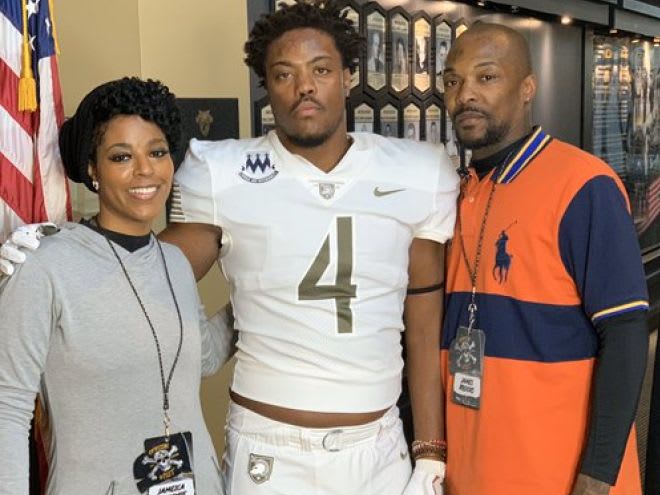 LB Kalvyn Crummie, along with his parents