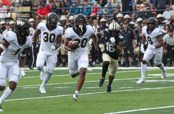 Coby Davis, here returning an interception for a touchdown against Vanderbilt, won't play again this season for Wake Forest. 