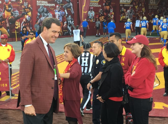 USC athletic director Mike Bohn, left, and university president Carol Folt were both involved in the decision to welcome back Reggie Bush.