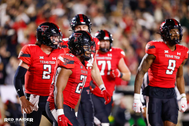 Tahj Brooks and his teammates celebrating the win over UCF Saturday