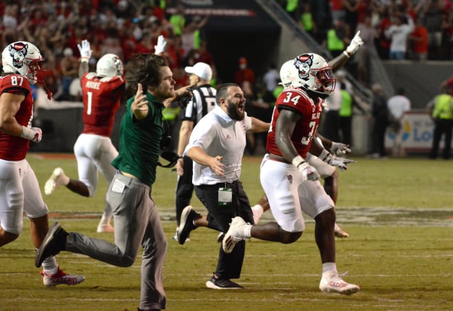 NC State Wolfpack football rushes the field before it fills with fans