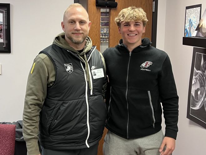 Army O-Line Coach Matt Drinkall with 2025 safety prospect Nolan Anderson during in-school visit