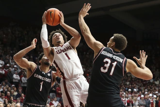 Alabama guard Mark Sears (1) shoots defended by South Carolina guard Jacobi Wright (1) forward Benjamin Bosmans-Verdonk (31) for a basket inside at Coleman Coliseum. Photo | Gary Cosby Jr.-USA TODAY Sports