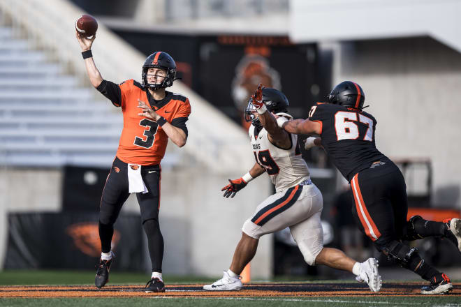 Joshua Gray (67) protects quarterback Tristan Gebbia (3) - Karl Maasdam