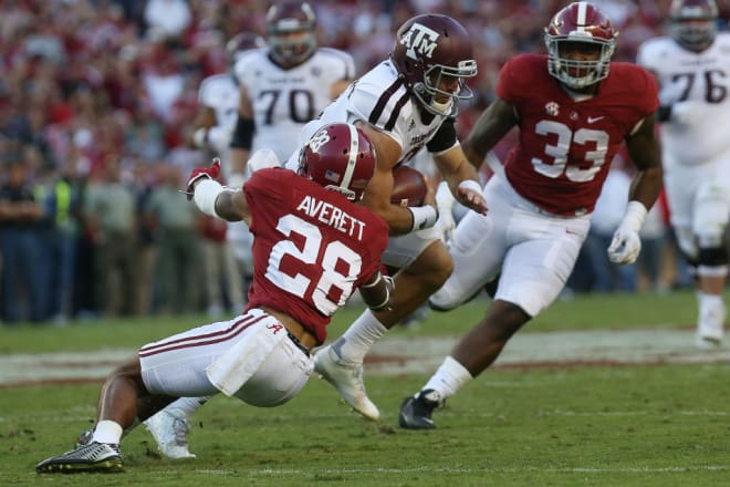 Alabama defensive back Anthony Averett (28) tackles Texas A&M quarterback Trevor Knight (8) during the second half of a game against the Texas A&M Aggies at Bryant-Denny Stadium in Tuscaloosa on Saturday, Oct. 22, 2016. Alabama defeated the Aggies 33-14.