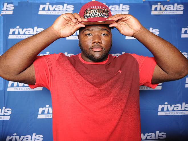 Marvin Wilson tried on several hats during the Under Armour photo session Tuesday.