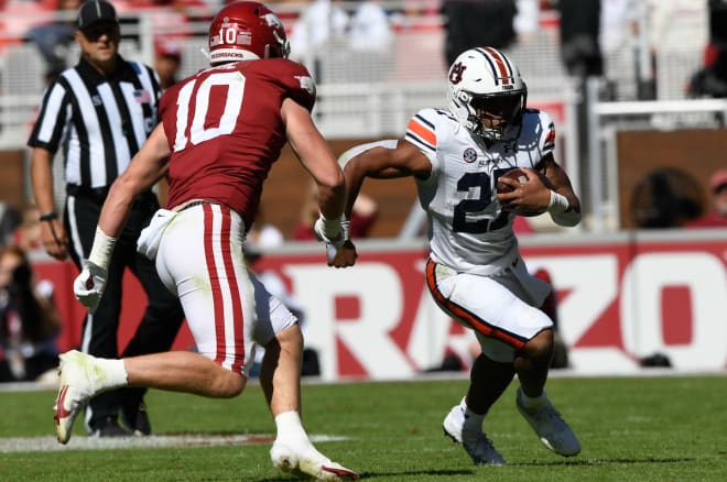 Jarquez Hunter rushes the ball against Arkansas.