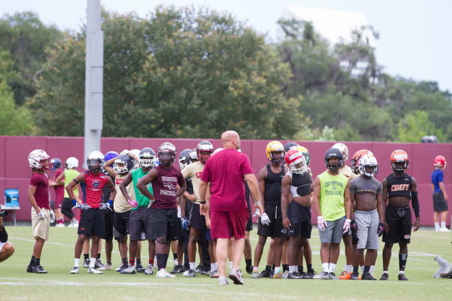 FSU defensive coordinator Charles Kelly oversees a group of the campers.