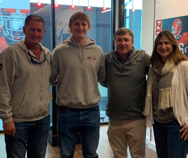Colton Heinrich joins his family during their official visit last year.