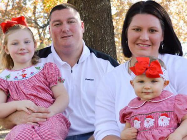 Former Ole Miss center/tight end Justin Sawyer, shown here with his family in a photo posted on his Facebook profile page, died early Saturday of an apparent heart attack. Sawyer, the center on Ole Miss' 2003 Cotton Bowl championship team, was 36.