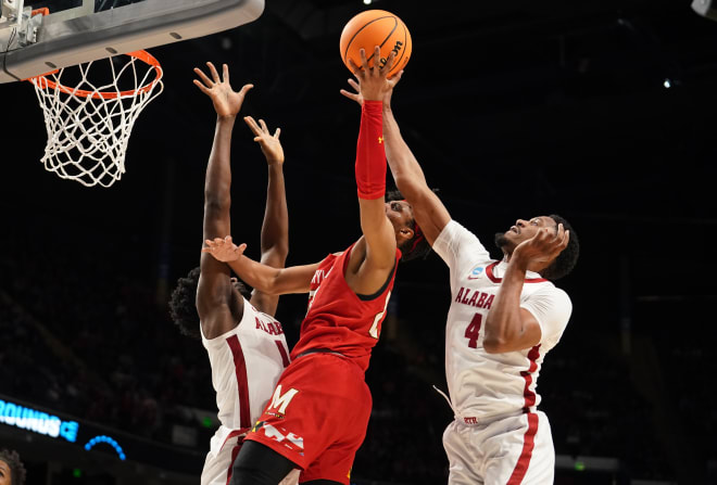 Maryland Terrapins guard Ian Martinez (23) shoots against Alabama Crimson Tide center Charles Bediako (14) and forward Noah Gurley (4) during the second half at Legacy Arena. Photo |  Marvin Gentry-USA TODAY Sports