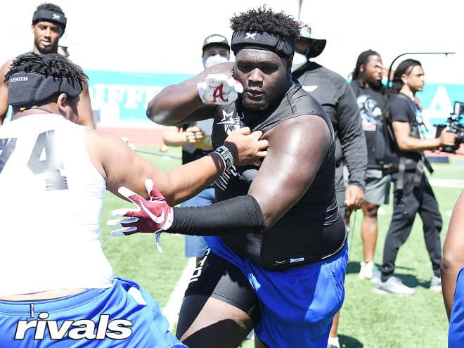 Florida defensive tackle Tawfiq Thomas holds a Michigan Wolverines football recruiting offer 
