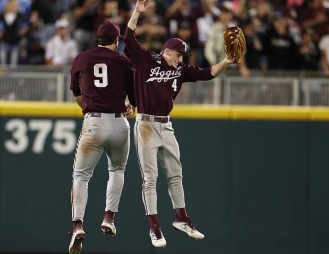 Gavin Grahovac and Travis Chestnut celebrate after clinching a spot in the CWS finals. (Texas A&M Athletics)