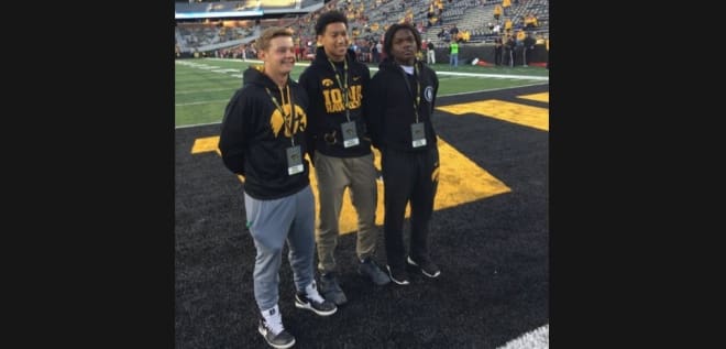 Dayson Clayton, right, with teammates Drake Miller and Tysen Kershaw at Iowa on Saturday.