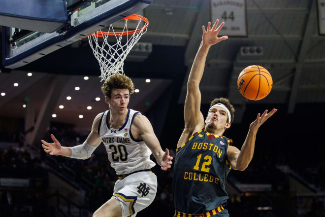 Boston College's Quinten Post, right, goes up for a rebound against Notre Dame's J.R. Konieczny earlier this season. 