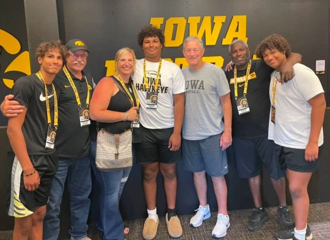 Class of 2023 defensive lineman Maddux Borcherding-Johnson, center, is going to be a Hawkeye.