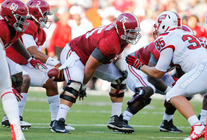 Alabama offensive lineman Bradley Bozeman (75) snaps the ball directly to Alabama quarterback Jalen Hurts (2) during Alabama's home opening 38-10 victory over the Hilltoppers in Bryant-Denny Stadium, September 10, 2016.
