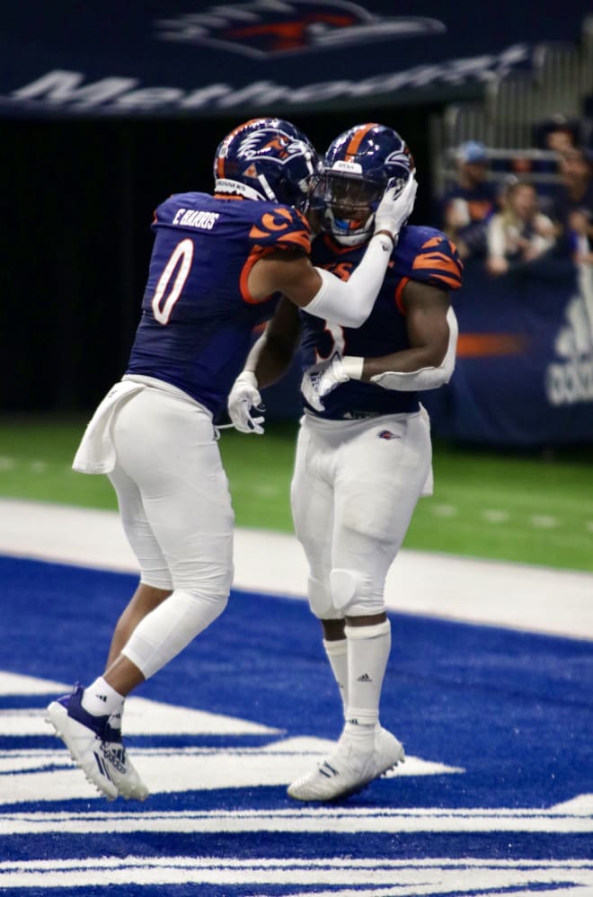 Frank Harris congratulates teammate Sincere McCormick in the endzone during the second half against Louisiana Tech.