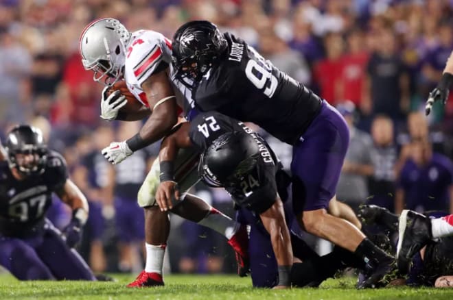 Dean Lowry and Ibraheim Campbell tackle OSU's Carlos Hyde.