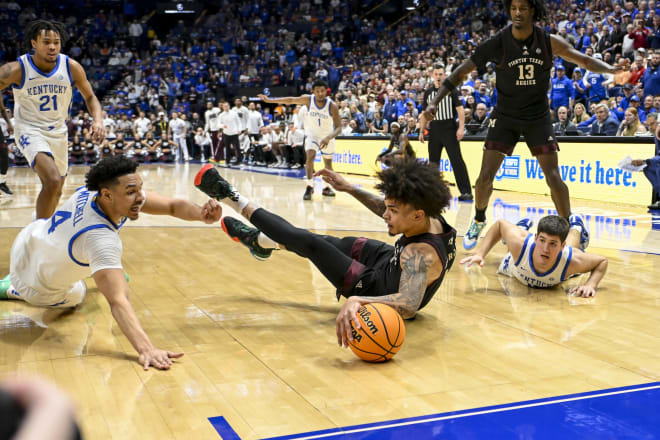 Kentucky's Tre Mitchell and Reed Sheppard scrambled for a loose ball during Friday's 97-87 loss to Texas A&M in the quarterfinals of the SEC Tournament at Bridgestone Arena in Nashville.