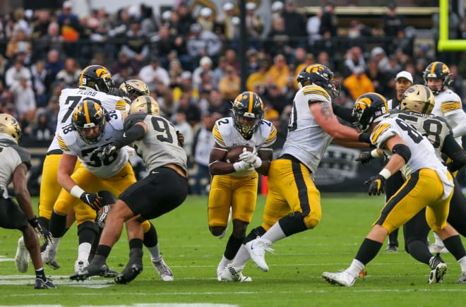 Iowa Hawkeyes running back Kaleb Johnson (2) breaks through the Purdue Boilermakers defensive line during the NCAA football game against the Purdue Boilermakers, Saturday, Nov. 5, 2022, at Ross-Ade Stadium in West Lafayette, Ind.