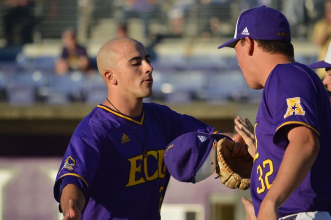ECU Saturday starter Jake Kuchmaner receives congratulations after leaving the game in the ninth inning.