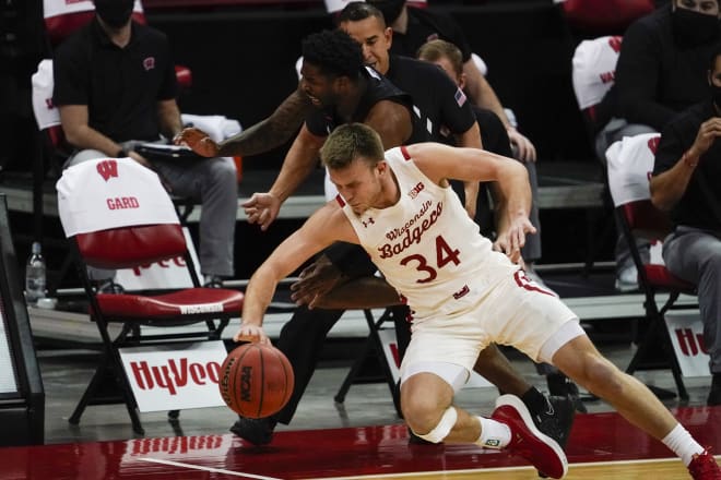 Wisconsin's Brad Davison and Penn State's Jamari Wheeler go after a loose ball during the Badgers' 72-56 win Tuesday.