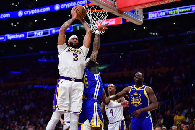 Los Angeles Lakers forward Anthony Davis (3) gets the rebound against Golden State Warriors guard Gary Payton II (8) and forward Draymond Green (23) during the second half in game three of the 2023 NBA playoffs at Crypto.com Arena. Mandatory Credit: Gary A. Vasquez-USA TODAY Sports