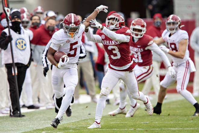 Alabama Crimson Tide receiver Javon Baker (5) evades a tackles against Arkansas last season. Photo | Getty Images 