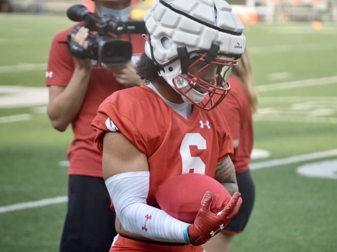 Running back Chez Mellusi during fall camp practice in August.