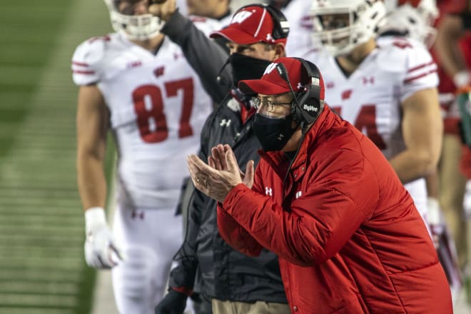 Wisconsin coach Paul Chryst cheers on his players from the sideline during the Badgers' 49-11 win at Michigan