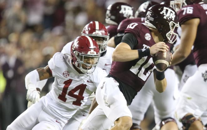 Texas A&M quarterback Zach Calzada (10) rolls away from pressure by Alabama defensive back Brian Branch (14) at Kyle Field. Texas A&M defeated Alabama 41-38 on a field goal as time expired. Photo | Gary Cosby Jr.-USA TODAY Sports