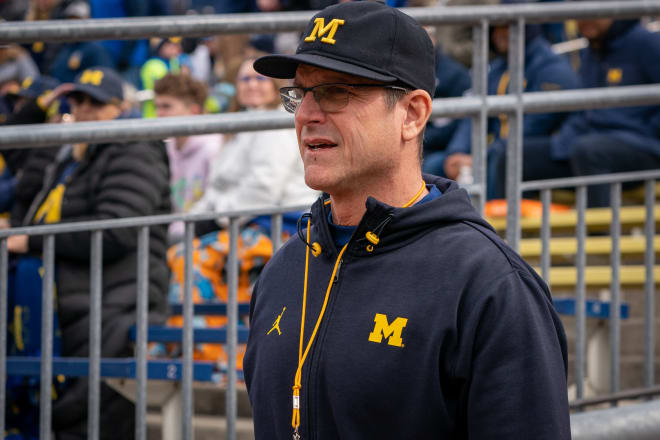  Michigan Football Head Coach, Jim Harbaugh, walks out of the tunnel prior to the spring football game at Michigan Stadium on April 2, 2022 in Ann Arbor, Michigan. 