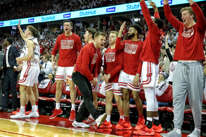 Brad Davison celebrates on the sidelines during Wisconsin's 64-63 victory over Michigan State.