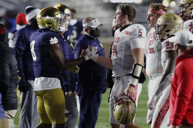 Boston College QB Phil Jurkovec (5) greats former teammate Jafar Armstrong (8) following a 45-31 Notre Dame win in 2020.