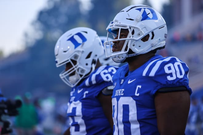 Duke will need a big-time performance from DeWayne Carter, right, to get pressure against Drake Maye.