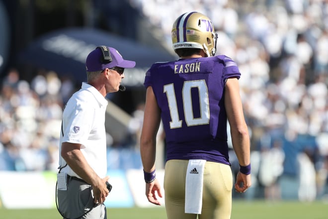 Washington Huskies head coach Chris Petersen and quarterback Jacob Eason (10) talk on the field during the fourth quarter against the BYU Cougars at LaVell Edwards Stadium. Photo Credit: Melissa Majchrzak-USA TODAY Sports