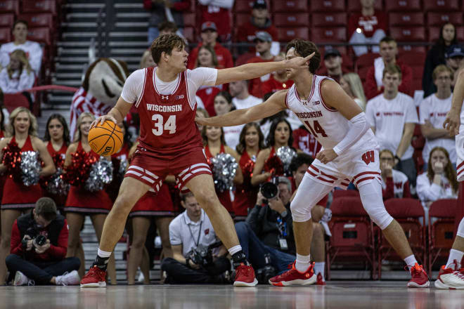 Gus Yalden (34) is defended by Carter Gilmore during Wisconsin's Red-White Scrimmage in October