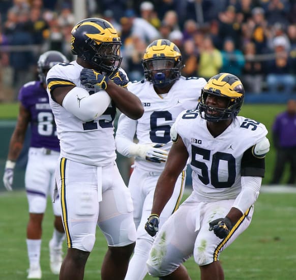 Michigan football redshirt junior tackle Mike Dwumfour (No. 50) has been solid in the middle of the defensive line. 
