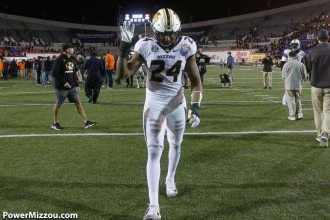 Terez Hall walks off the field after his final college game
