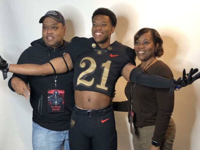 Talented CB Tim Boone surrounded by his parents during is recent OV