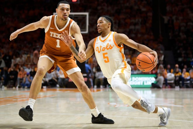 Tennessee guard Zakai Zeigler (5) drives on Texas forward Dylan Disu (1) in the second half of game on Jan. 28, 2023.