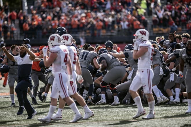 Wisconsin players watch as Illinois celebrates following last season's game-winning field goal.