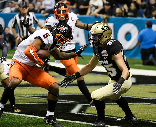 SAN ANTONIO, TX - December 29: Colorado Buffaloes running back Beau Bisharat #35 pursues Oklahoma State Cowboys cornerback Ashton Lampkin #6 after Lampkin intercepted a pass thrown by Colorado Buffaloes quarterback Steven Montez (not pictured) in the second quarter of the Valero Alamo Bowl at the Alamodome December 29, 2016. (Photo by Andy Cross/The Denver Post via Getty Images)