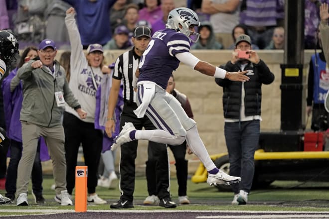 Adrian Martinez skips into the endzone against Missouri, with Gene Taylor watching on