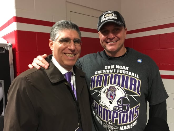 Colonial Athletic Association commissioner Joe D'Antonio (left) poses with James Madison football coach Mike Houston in January.