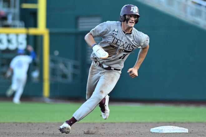 Texas A&M's Jace LaViolette rounded second base as Kentucky right fielder James McCoy attempted to chase down an Aggies hit into the corner during the decisive sixth inning.