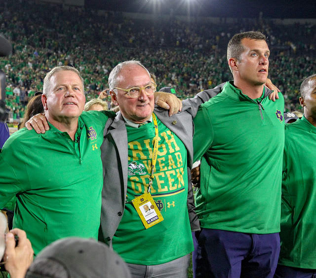 Notre Dame football head coach Brian Kelly (left) and director of athletics Jack Swarbrick (center)